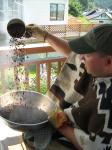 Jeremy Maxand uses a simple method to cool off the coffee beans after they've been roasted.
